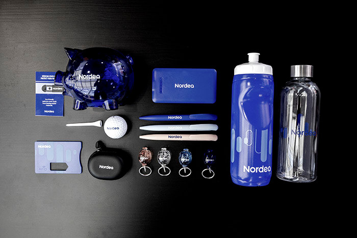 Different Nordea product media, like pens and bottles