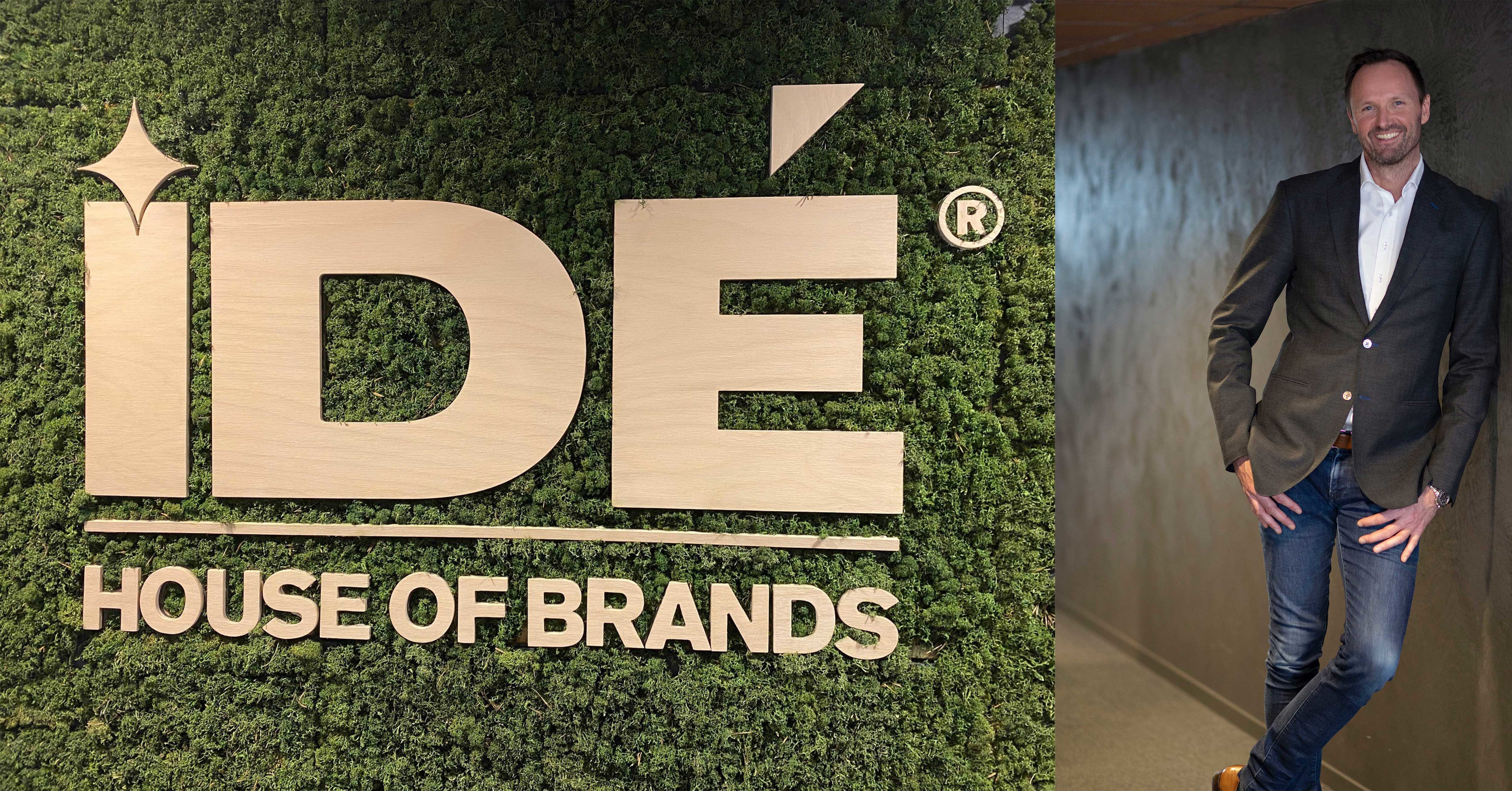 Grønn IDÉ House of Brands logo og en mann som smiler